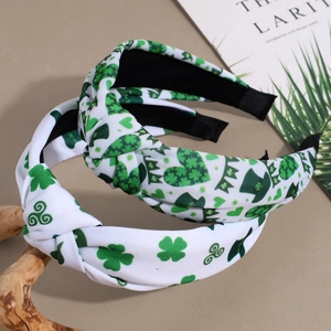Set of St. Patrick's Day knotted headbands with green shamrock and clover patterns