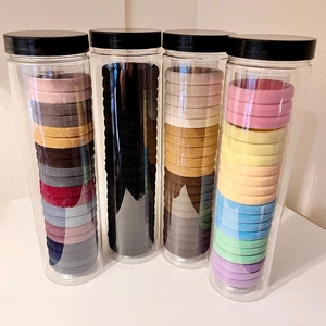 Lot d'élastiques à cheveux haute élasticité en quatre bocaux aux couleurs variées