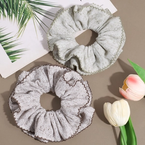 Double-layered knitted scrunchies with scalloped edges in retro green and taupe colors