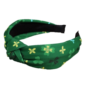Green St. Patrick's Day knotted headband featuring lucky clover leaf patterns