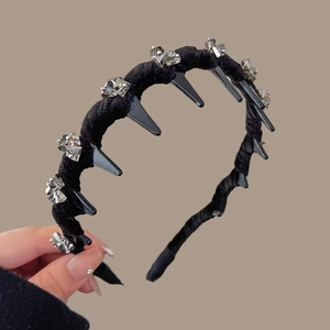 Detail view of crystal velvet headband showing internal anti-slip comb teeth and gemstones