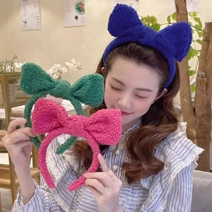 Cute lamb wool bow headband in navy blue, green, and pink colors for winter hair styling