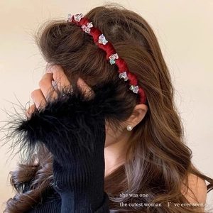 Elegant red velvet twist headband with crystal bow accents for women's vintage hair styling