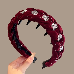 Detail of dark red velvet braided headband with rhinestones and inner non-slip teeth