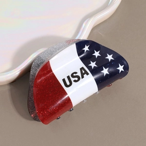 Close-up of USA American flag mini claw clip with glitter finish and stars pattern