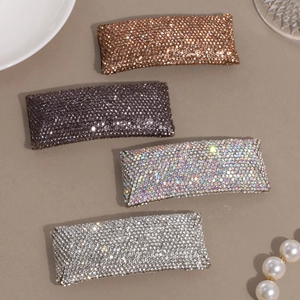 Sparkling rhinestone hair clip set in four elegant colors with light luxury jewelry display