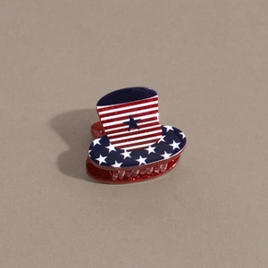 Detailed macro of patriotic top hat hair claw with American flag stars and stripes