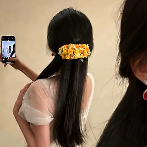 Floral fabric hair clip in yellow and orange silk with sparkling rhinestones for women