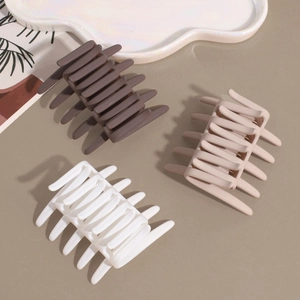 Minimalist large cross teeth hair combs in grey, beige, and white colors for women