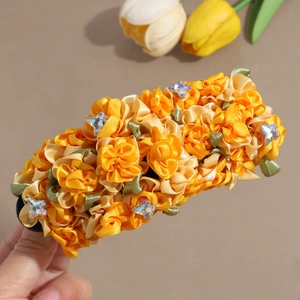 Handmade yellow silk rose flower hair clip with sparkling star rhinestones and green leaves