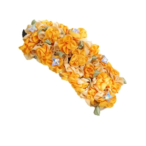 Yellow fabric flower duckbill hair clip with green leaves and rhinestone accents