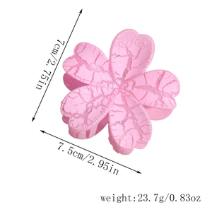 Pink sakura flower hair claw with marble texture finish measuring 7.5cm by 7cm