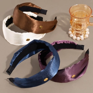 Elegant wide satin headbands with golden metal tags in four colors for women