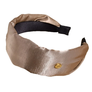Elegant champagne gold satin twisted headband with smile metal label for women