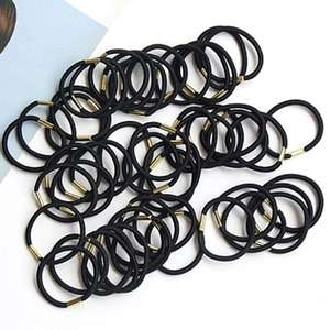 Bulk pack of high-elastic black hair ties with gold metal connectors on a clean background
