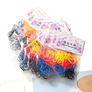 Detail shot of multi-color elastic hair ties set in retail bags with card headers