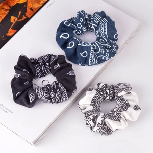 Three-piece set of paisley print scrunchies in navy, black and white cotton fabric