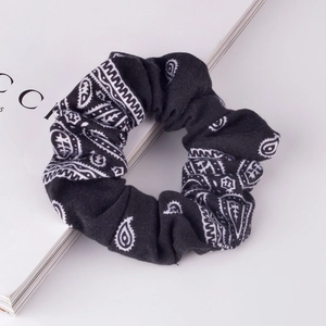 Classic black paisley print fabric scrunchie with vintage aesthetic for women