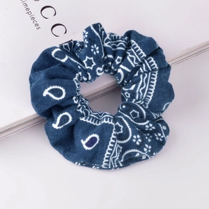 Vintage navy blue paisley print scrunchie made of soft fabric for retro hair styling