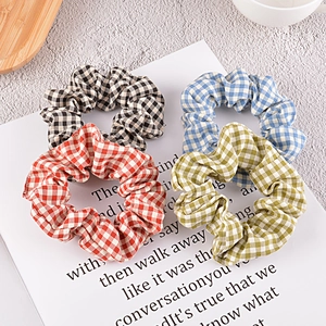 Gingham pattern fabric scrunchies in red, blue, green, and black for women's hair styling
