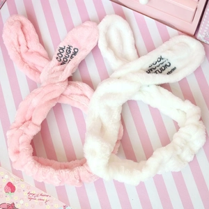Plush bunny ear headbands in pink and white soft coral fleece for skincare and makeup