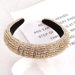 Close-up of sparkling rhinestones and black velvet lining on luxury headband