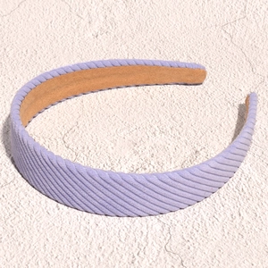 Detailed texture of lavender corduroy wide headband with a soft striped fabric finish