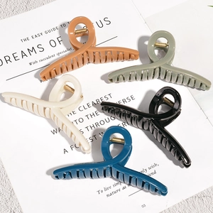 Set of 5 large acrylic hair claw clips in various colors with a sleek twist design