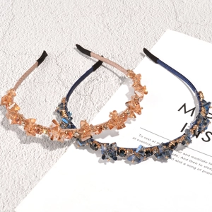 Baroque style crystal headbands in champagne and sapphire blue with metal claw settings