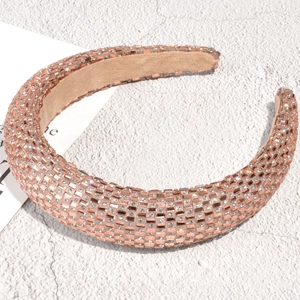 Detail of rose gold rhinestone sponge headband with checkered sparkling crystal patterns