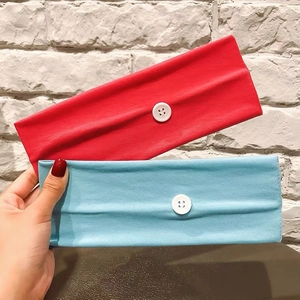Elastic wide headband with buttons for ear protection in red and blue colors