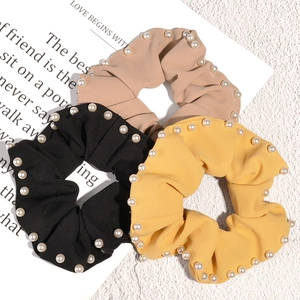 Three-piece pearl trim scrunchie set in black, yellow and beige stylish twill fabric