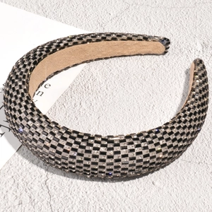 Macro detail of checkers rhinestone headband with thick padding and soft velvet lining