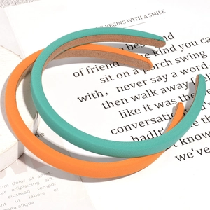 Orange and mint green padded sponge headband set with fine fabric texture and non-slip lining