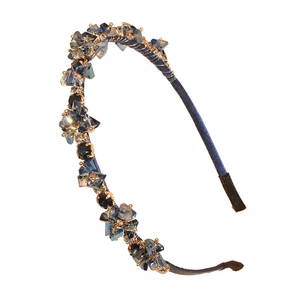 Baroque style headband with blue crystals and gold beads on a navy satin base