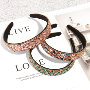 Detail shot of baroque leaf headbands with multicolored rhinestones and metal chain weave