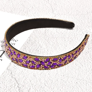 Detailed macro view of Baroque leaf headband with purple crystals and gold beads