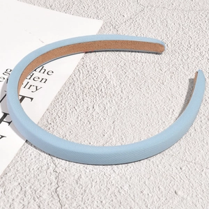Detail showing light blue fabric headband with soft sponge padding and non-slip lining