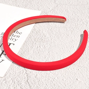 Detailed close-up of a red padded sponge headband with premium fabric texture
