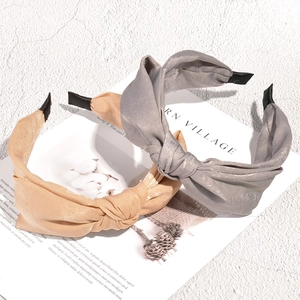 French style knotted fabric headbands in light beige and gray silk satin texture
