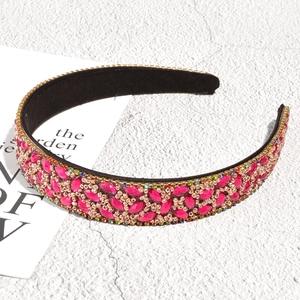 Detail of luxury baroque leaf headband with pink rhinestones and bronze bead embroidery