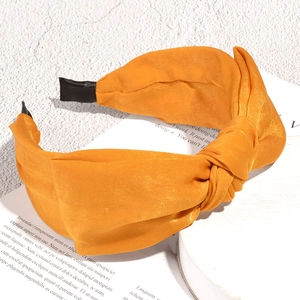 Elegant orange silk-like fabric top knot headband with wide frame for women