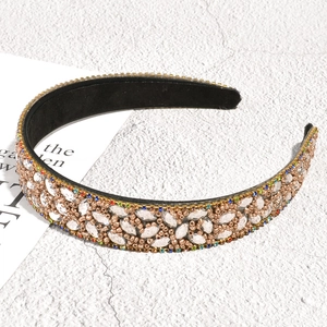 Close-up detail of champagne leaf headband with rhinestones and luxury beaded embroidery