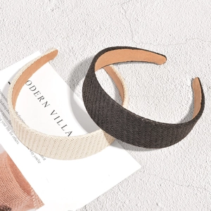 Fashionable wide woven raffia headbands in black and beige with premium braided texture