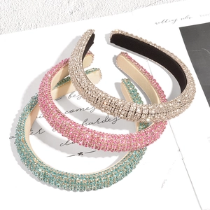 Three padded sponge headbands with sparkling rhinestones in silver-gold, pink, and blue