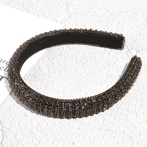 Detail view of luxury black rhinestone headband with soft non-slip velvet lining