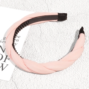 Close-up of pink braided headband showing chiffon texture and non-slip inner teeth detail