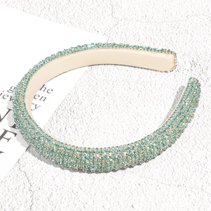 Detail of light blue crystal padded headband with sparkling rhinestones and retro style