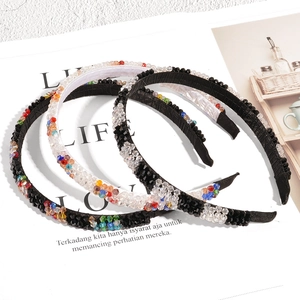 Three-piece set of handmade crystal beaded headbands in black and white with colorful rhinestones