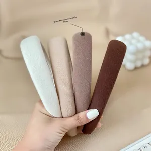 Detailed view of 14cm padded sponge headbands in four neutral earthy tones and fabric texture